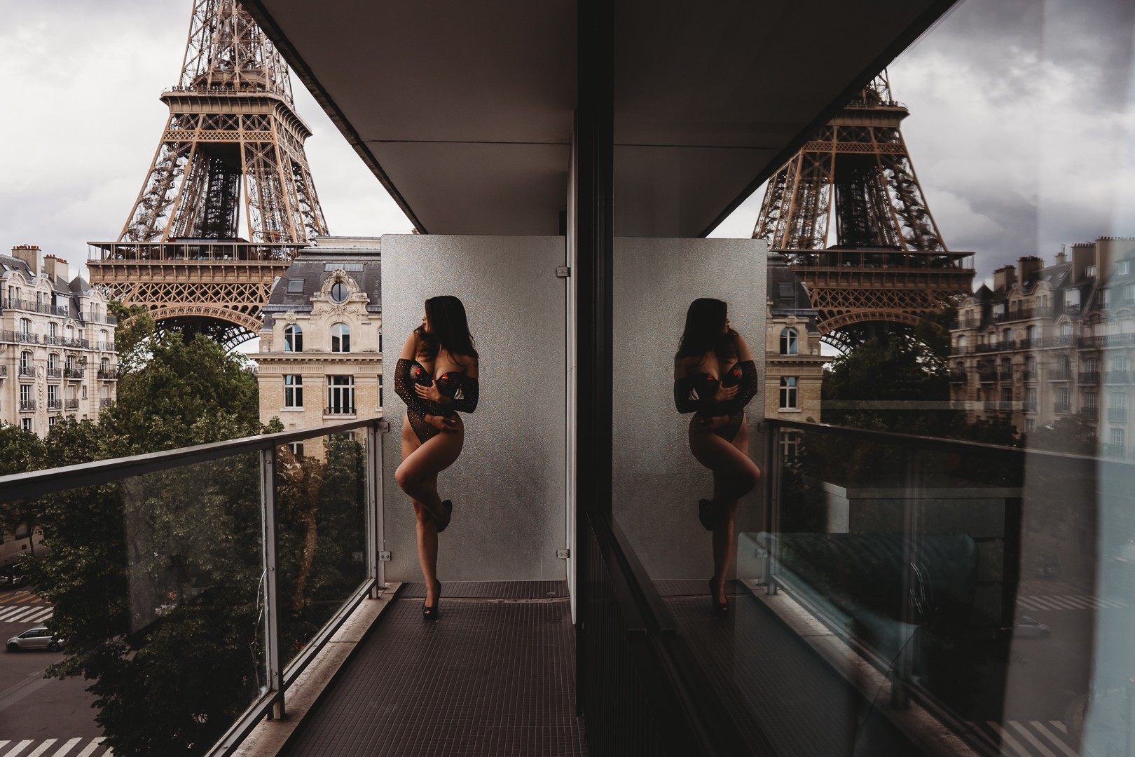 Paris boudoir session on a balcony facing the Eiffel Tower